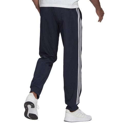 Spodnie męskie adidas Essentials Tapered Cuff 3 Stripes Pants granatowe GK8981 Adidas Spodnie męskie adidas Essentials Tapered Cuff 3 Stripes Pants granatowe GK8981 Adidas