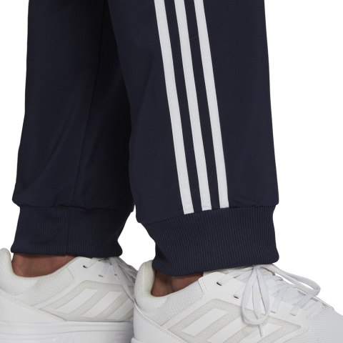 Spodnie męskie adidas Essentials Tapered Cuff 3 Stripes Pants granatowe GK8981 Adidas Spodnie męskie adidas Essentials Tapered Cuff 3 Stripes Pants granatowe GK8981 Adidas