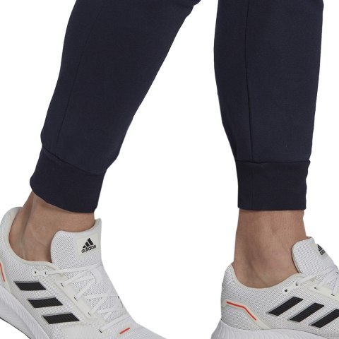 Spodnie męskie adidas Essentials Fleece Regular Tapered granatowe HL2231 Adidas Spodnie męskie adidas Essentials Fleece Regular Tapered granatowe HL2231 Adidas
