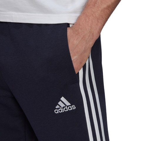Spodnie męskie adidas Essentials Tapered Elastic Cuff 3 Stripes Pant granatowe GK8830 S Adidas