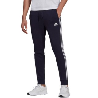 Spodnie męskie adidas Essentials Fleece Tapered Cuff 3-Band Pants granatowe GK8823 S Adidas