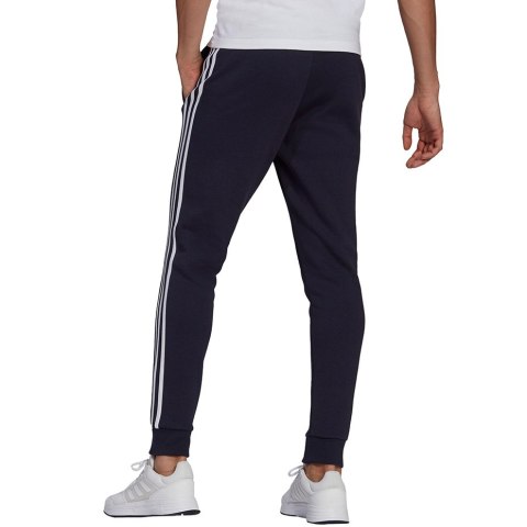 Spodnie męskie adidas Essentials Fleece Tapered Cuff 3-Band Pants granatowe GK8823 S Adidas