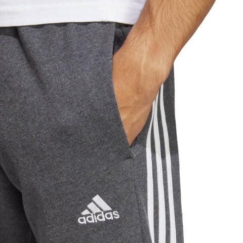 Spodnie męskie adidas Essentials French Terry Tapered Cuff 3-Stripes szare IC9408 Adidas Spodnie męskie adidas Essentials French Terry Tapered Cuff 3-Stripes szare IC9408 Adidas