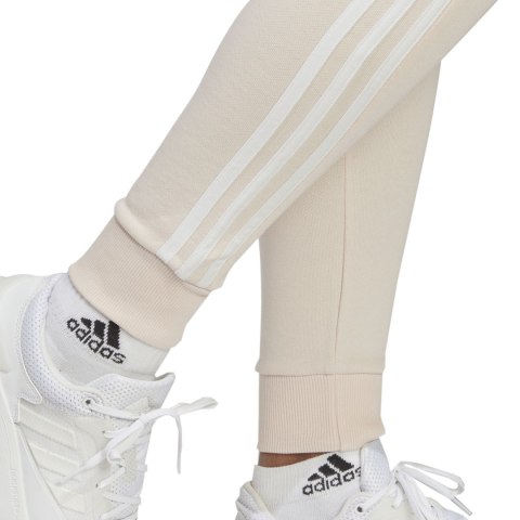Spodnie damskie adidas Essentials 3-Stripes French Terry Cuffed kremowe IC9924 Adidas Spodnie damskie adidas Essentials 3-Stripes French Terry Cuffed kremowe IC9924 Adidas