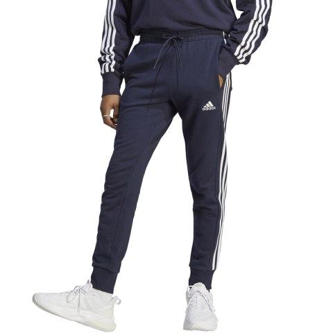 Spodnie męskie adidas Essentials French Terry Tapered Cuff 3-Stripes granatowe IC9406 Adidas Spodnie męskie adidas Essentials French Terry Tapered Cuff 3-Stripes granatowe IC9406 Adidas