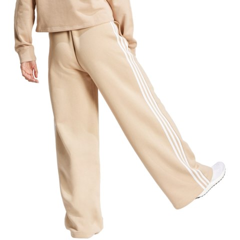 Spodnie damskie adidas Essentials 3-Stripes Fleece Wide beżowe IR5385 Adidas Spodnie damskie adidas Essentials 3-Stripes Fleece Wide beżowe IR5385 Adidas