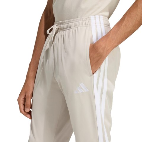 Spodnie męskie adidas 3-Stripes Tricot Regular Tapered beżowe JY7721 M Adidas
